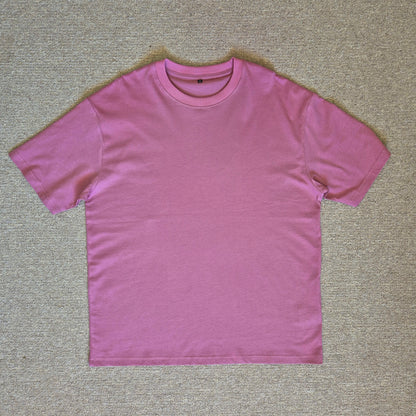Pink t-shirt on a beige carpet