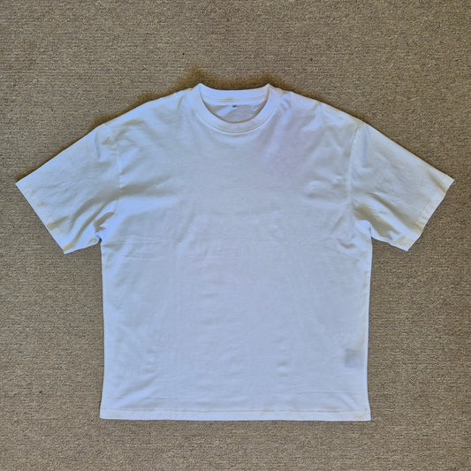 White t-shirt on a beige carpet